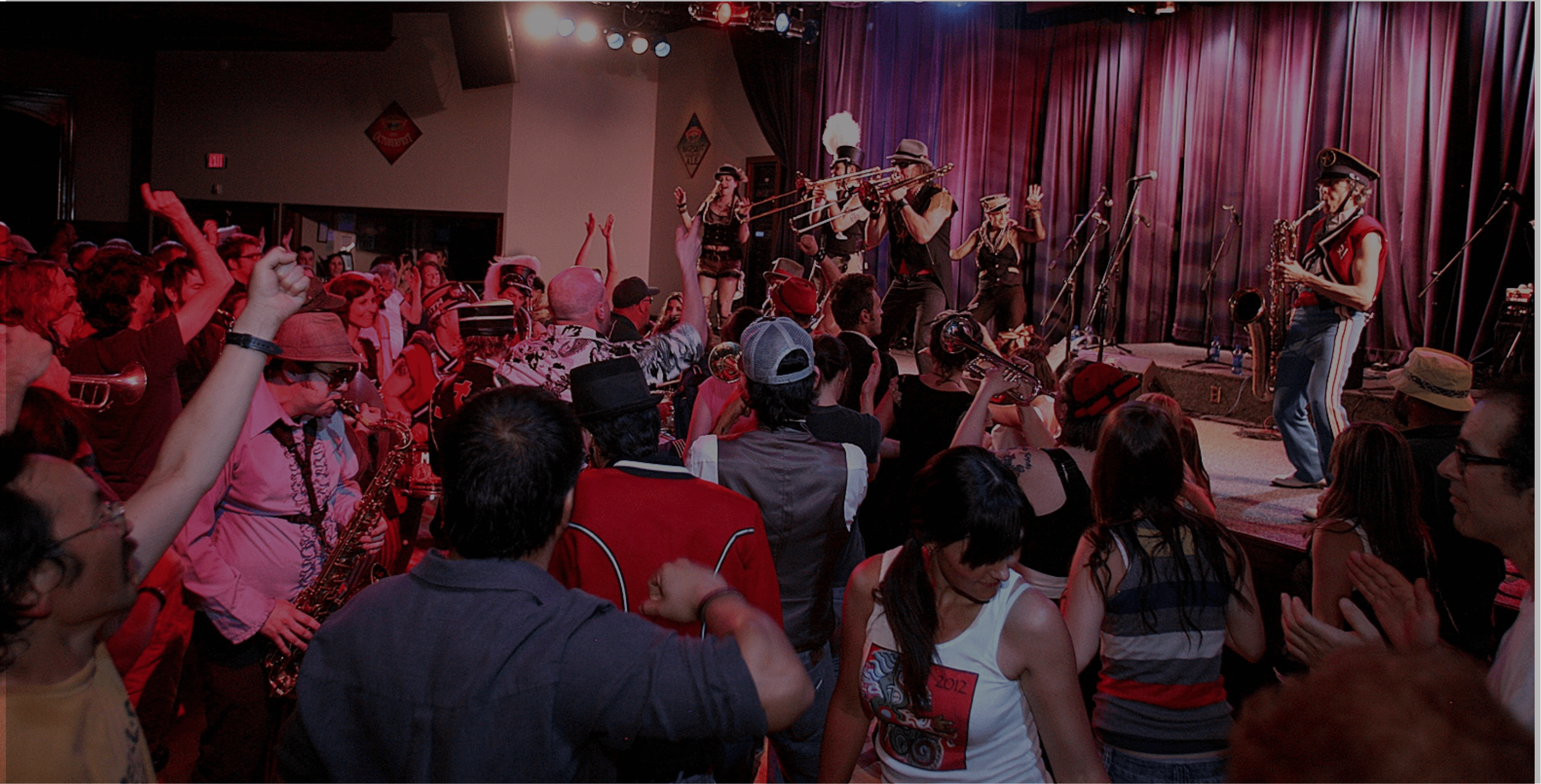 Crowd cheering for band playing on stage