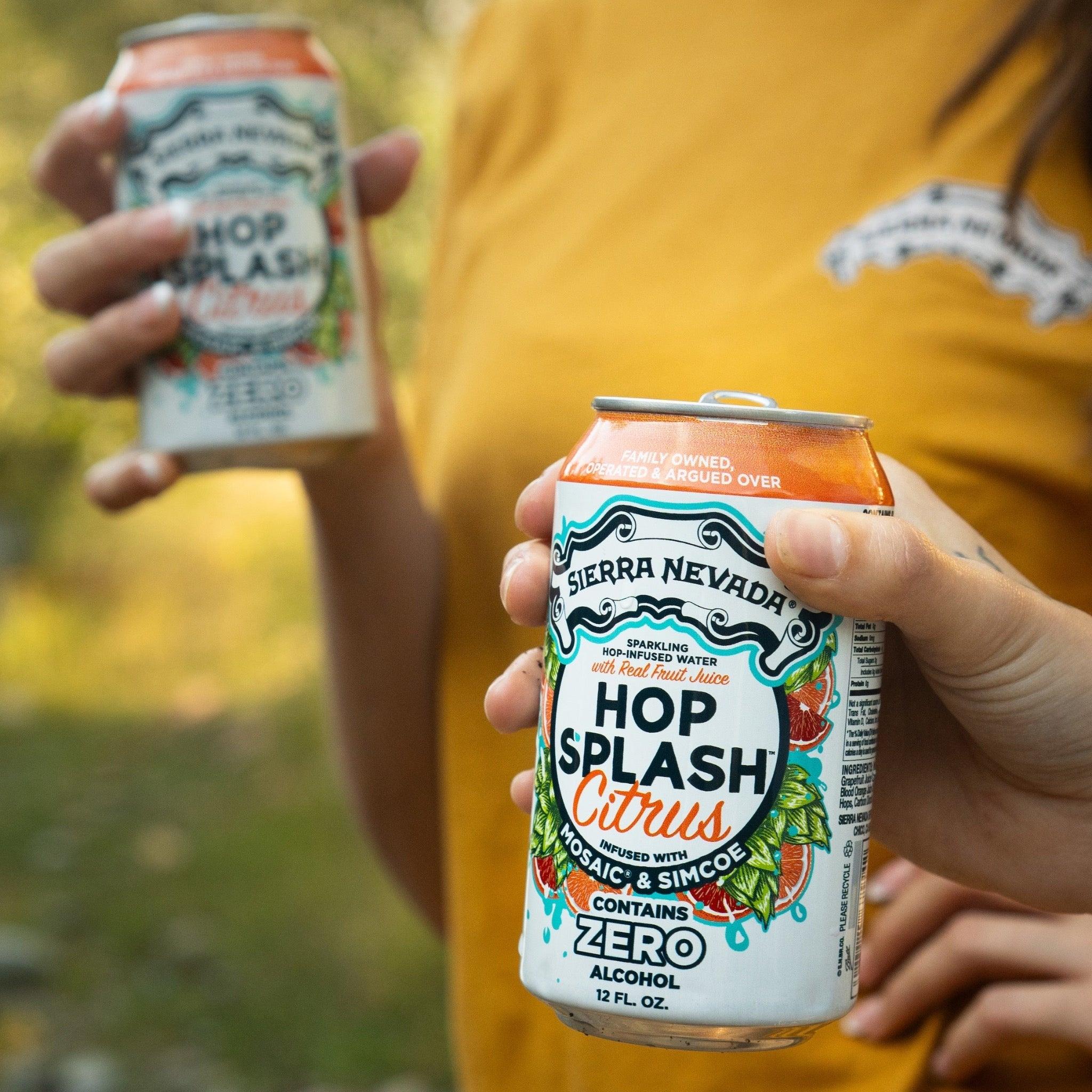 Sierra Nevada Brewing Co. Hop Splash Citrus Non-Alcoholic Sparkling Hop Water - Two friends hold cold cans of Hop Splash Citrus