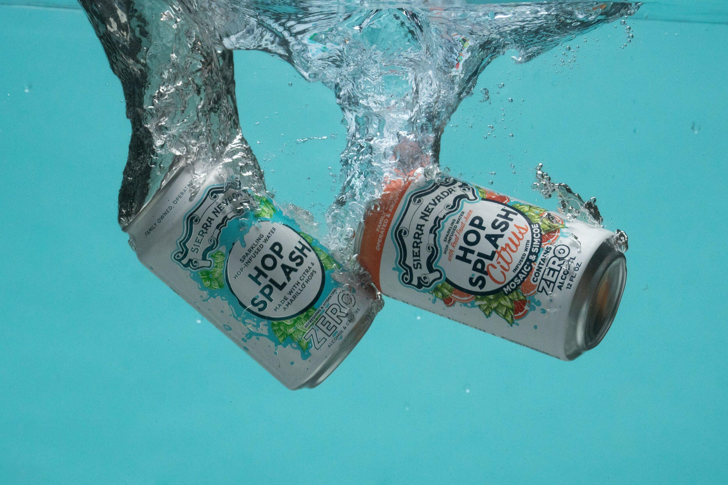 Two cans of Sierra Nevada Hop Splash hop water submerged in a water tank