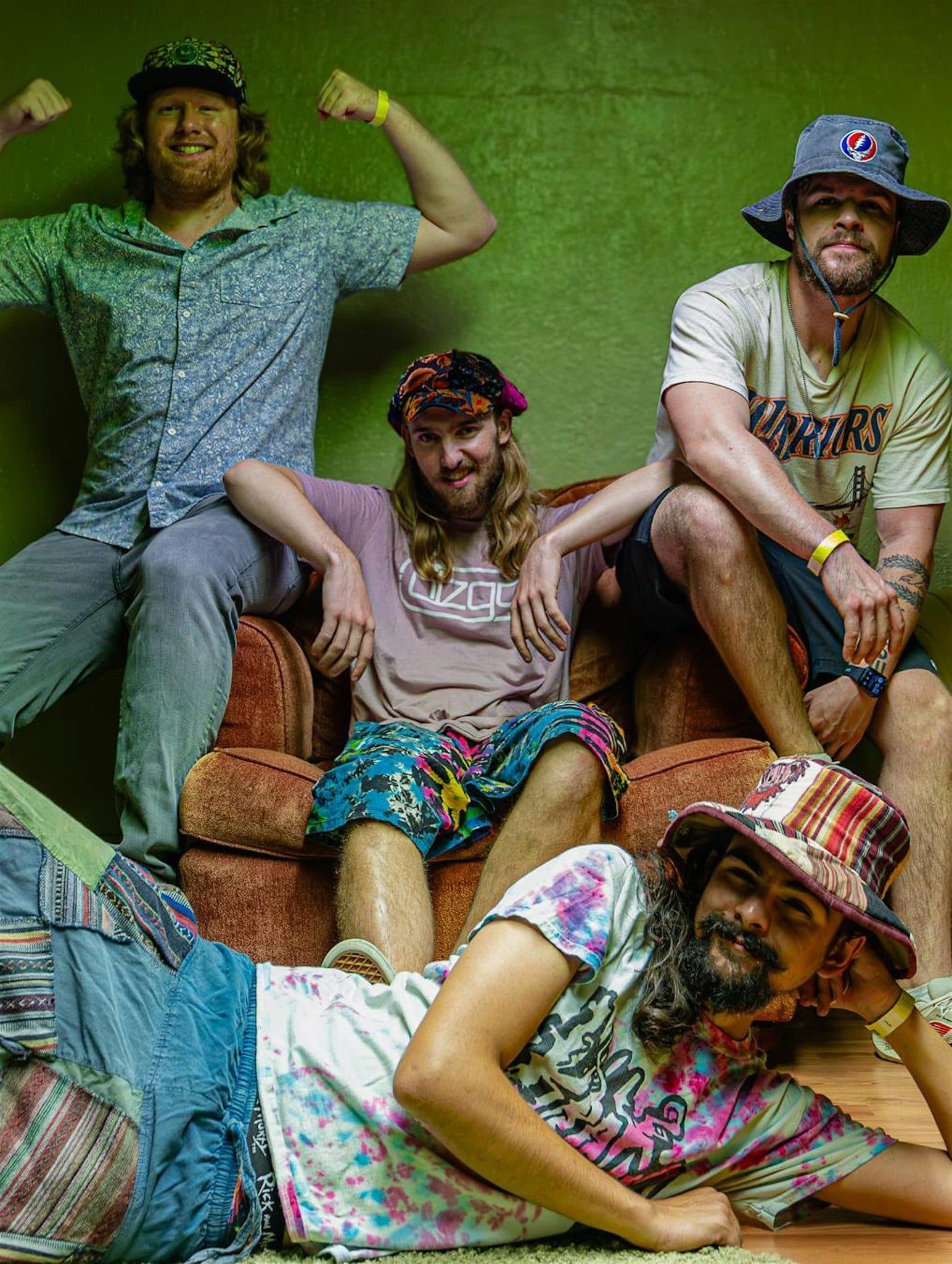 Blu Egyptian band sitting around and posing for a picture