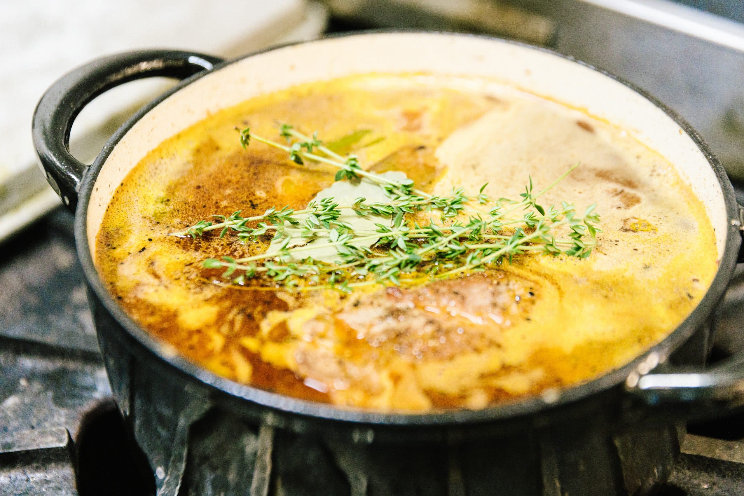 Chef cutting a head of cabbage next to Oktoberfest beer